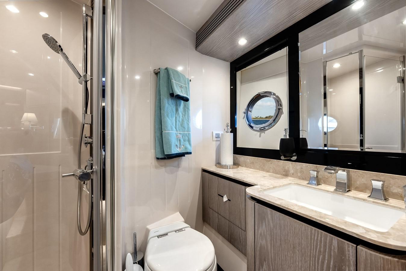 a bathroom with a sink and a mirror aboard PRODIGALITY 4 Yacht for Sale