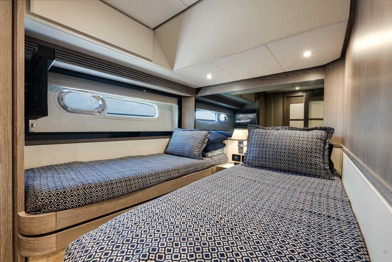 a room with a bed and a window aboard PRODIGALITY 4 Yacht for Sale