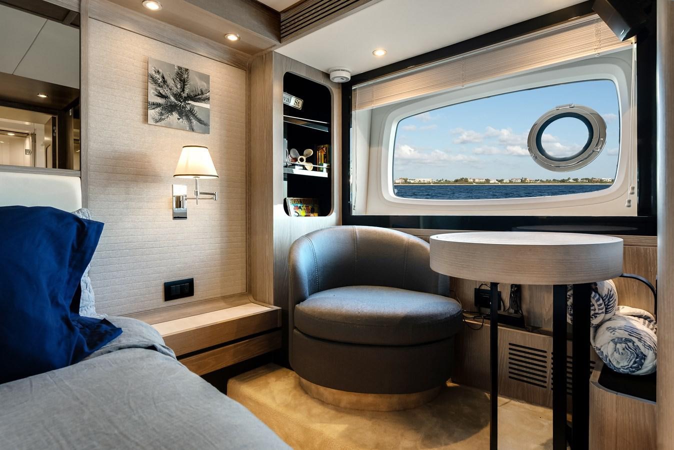 a room with a couch and a tv on the wall aboard PRODIGALITY 4 Yacht for Sale