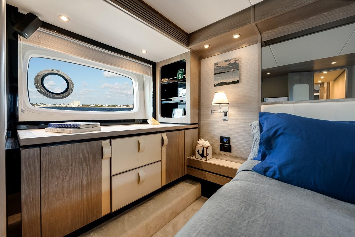 a bedroom with a bed and a tv aboard PRODIGALITY 4 Yacht for Sale