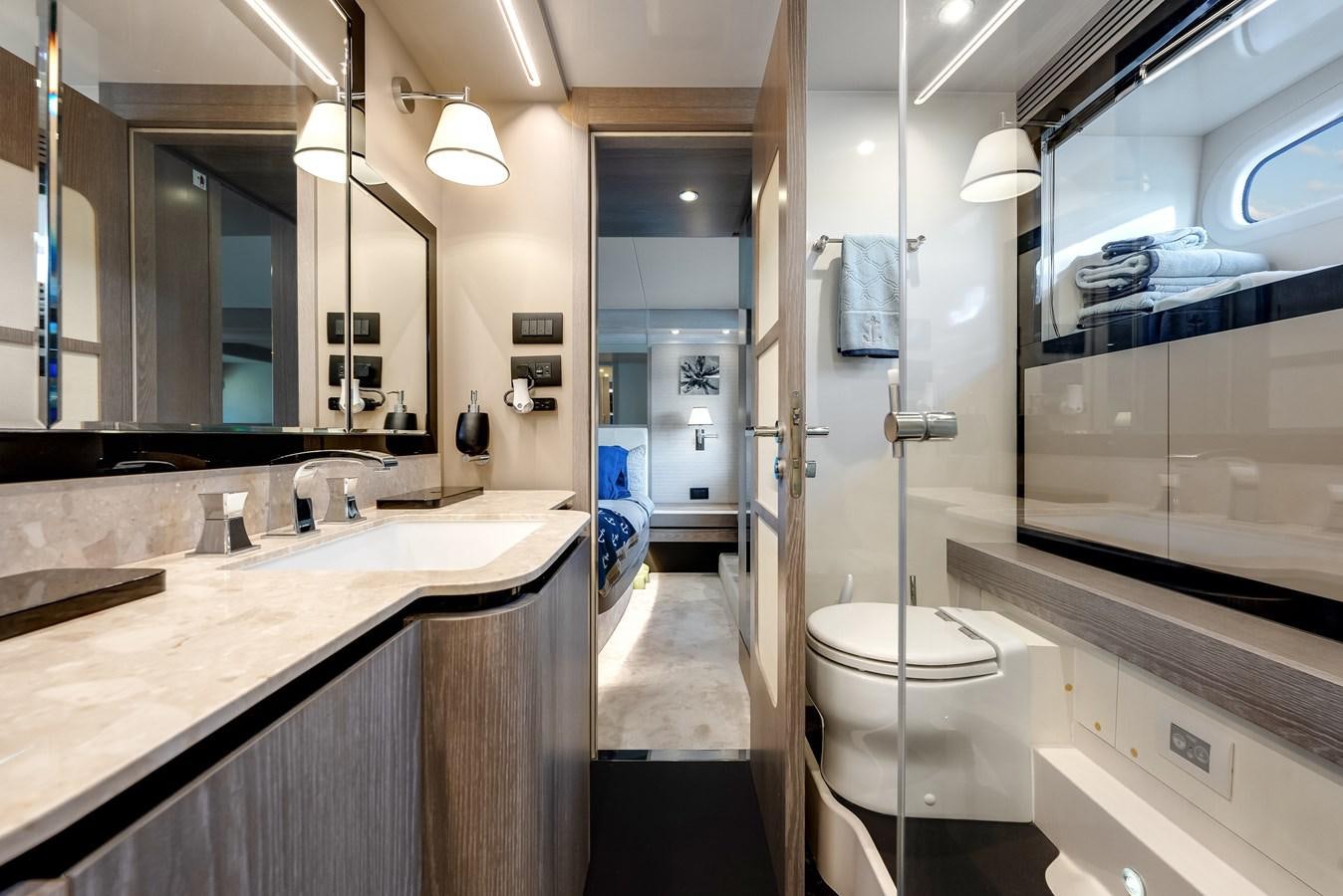 a bathroom with a glass shower aboard PRODIGALITY 4 Yacht for Sale