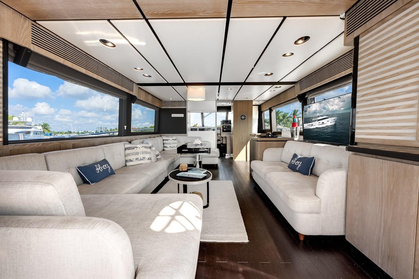 a living room with a large window aboard PRODIGALITY 4 Yacht for Sale