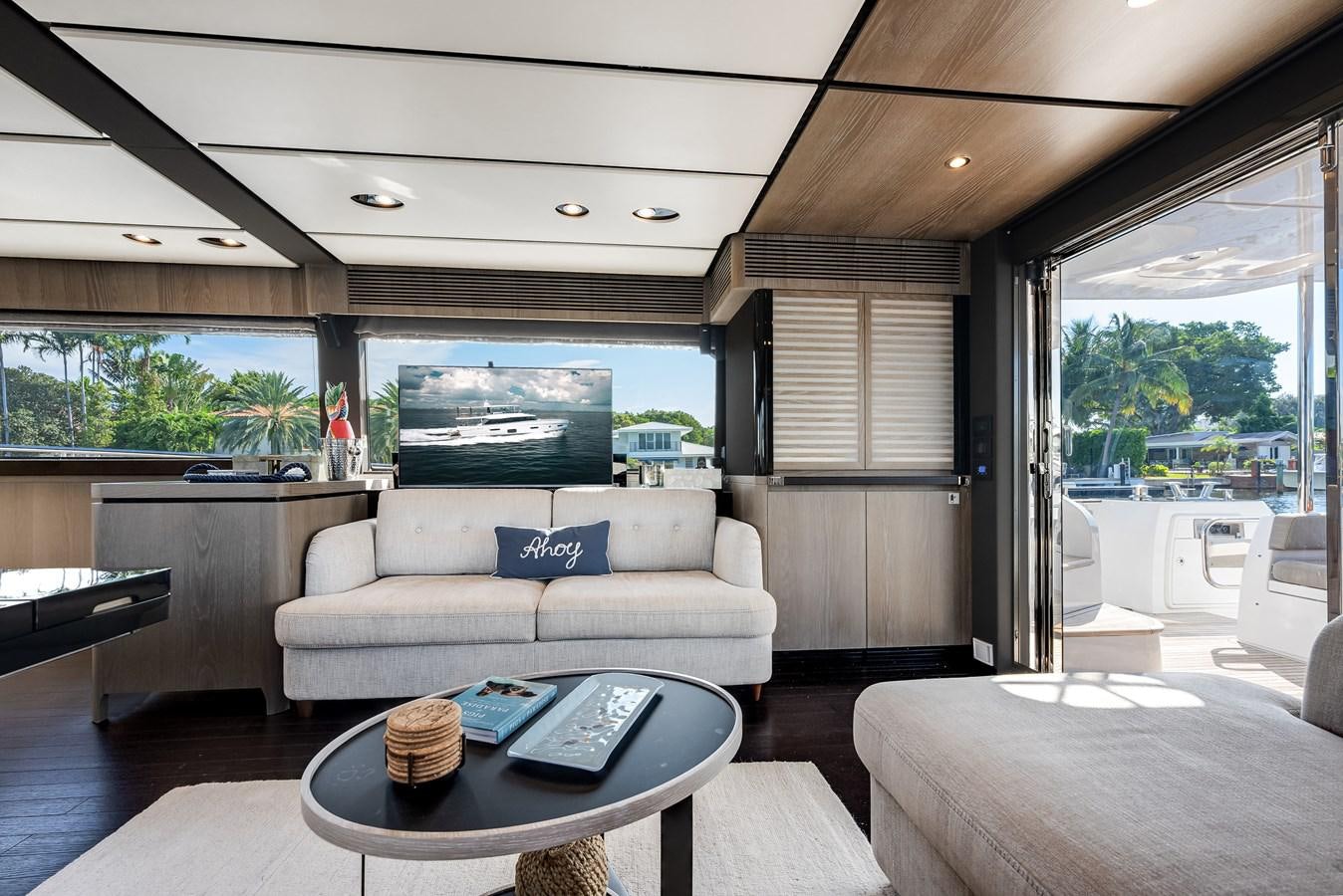 a living room with a couch and a table aboard PRODIGALITY 4 Yacht for Sale
