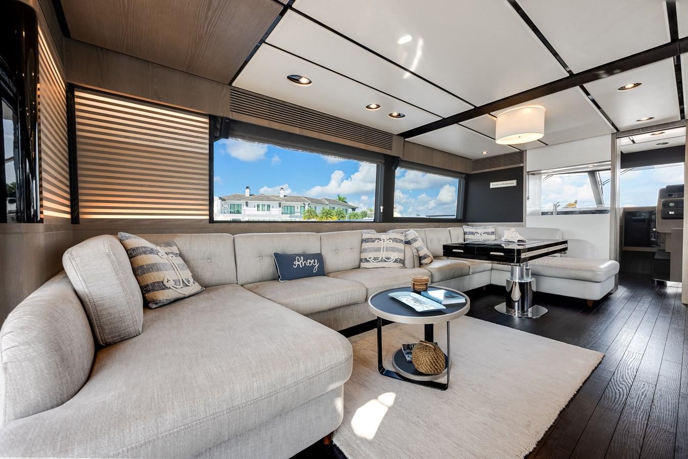 a living room with a couch and a table aboard PRODIGALITY 4 Yacht for Sale