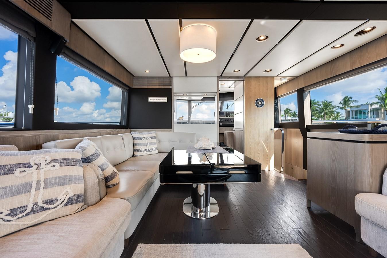 a living room with a couch and a table aboard PRODIGALITY 4 Yacht for Sale