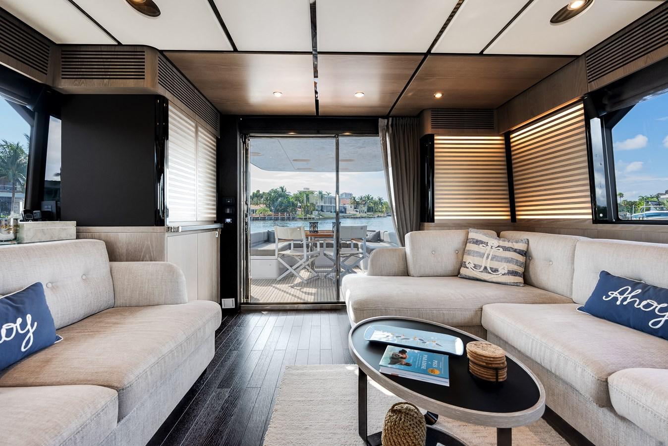 a living room with a couch and a table aboard PRODIGALITY 4 Yacht for Sale