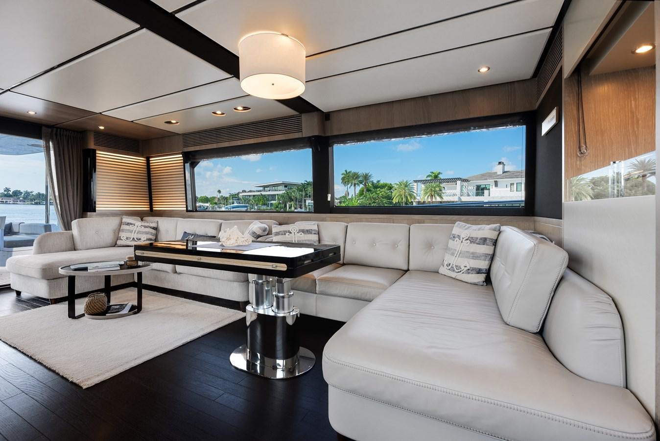a living room with a couch and a table aboard PRODIGALITY 4 Yacht for Sale