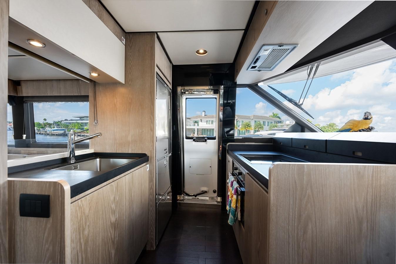 a kitchen with a large window aboard PRODIGALITY 4 Yacht for Sale