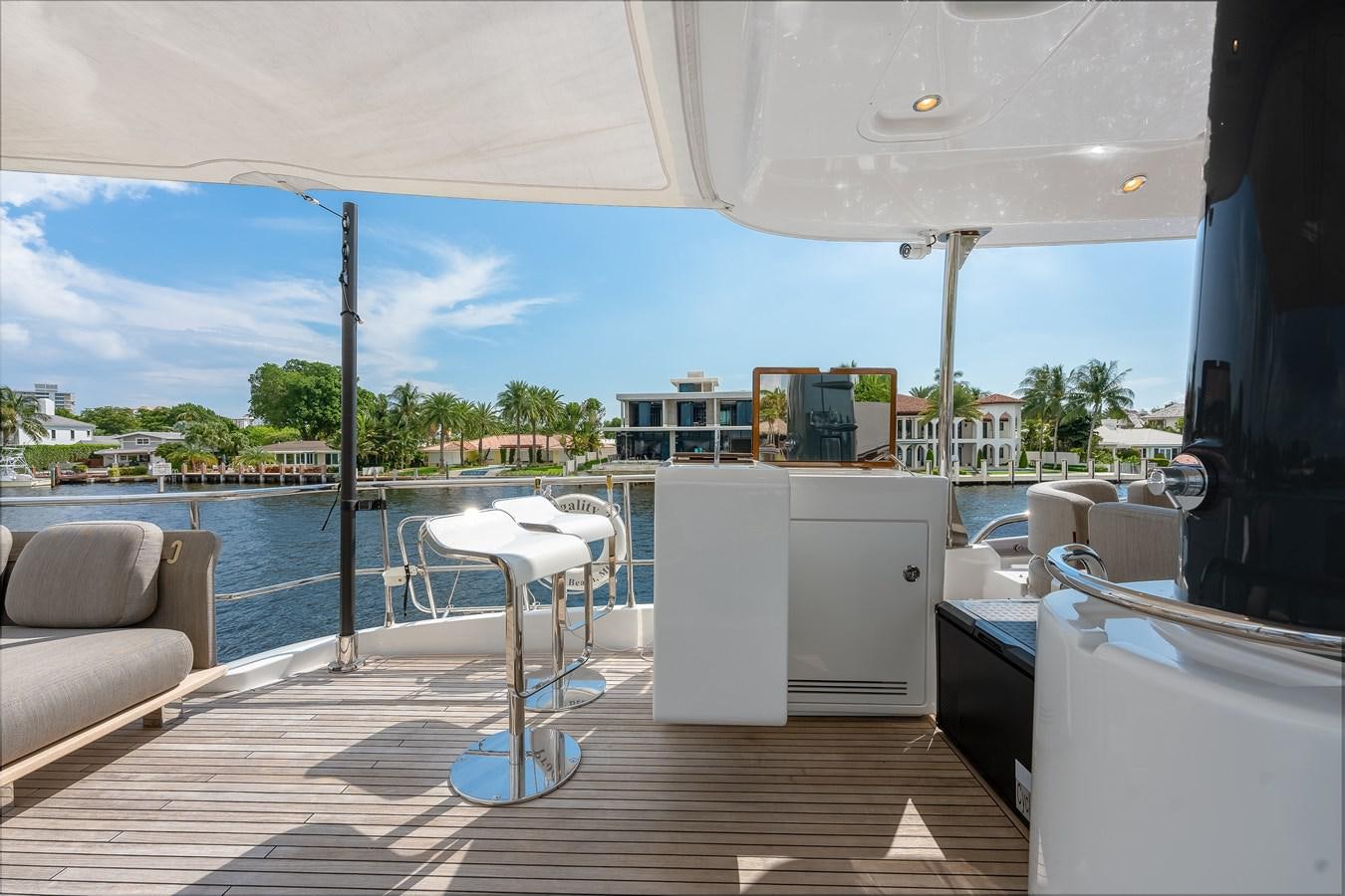 a deck with a view of a city and water aboard PRODIGALITY 4 Yacht for Sale