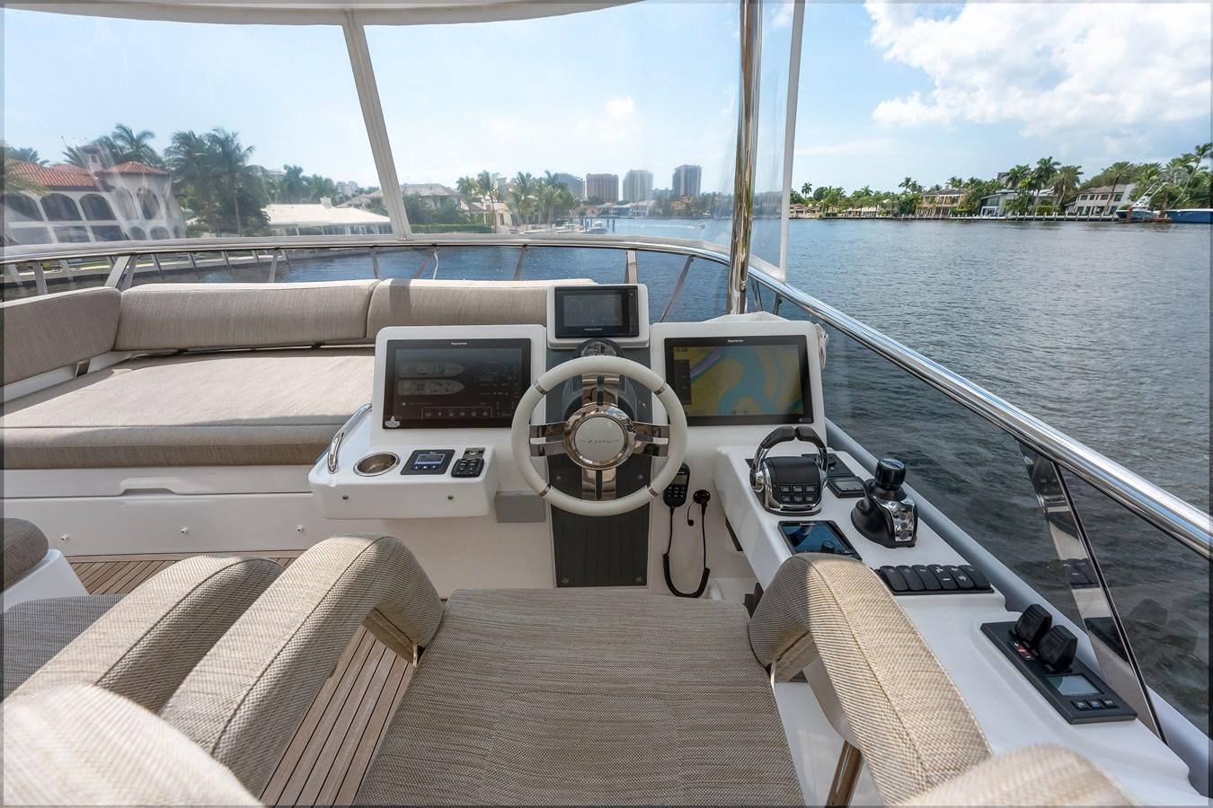 a boat with a steering wheel and a view of a city aboard PRODIGALITY 4 Yacht for Sale