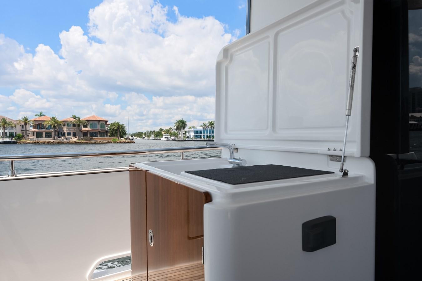 a white machine on a balcony aboard PRODIGALITY 4 Yacht for Sale