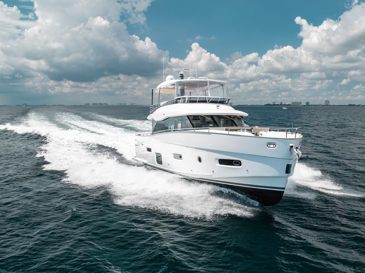a white boat on the water aboard PRODIGALITY 4 Yacht for Sale