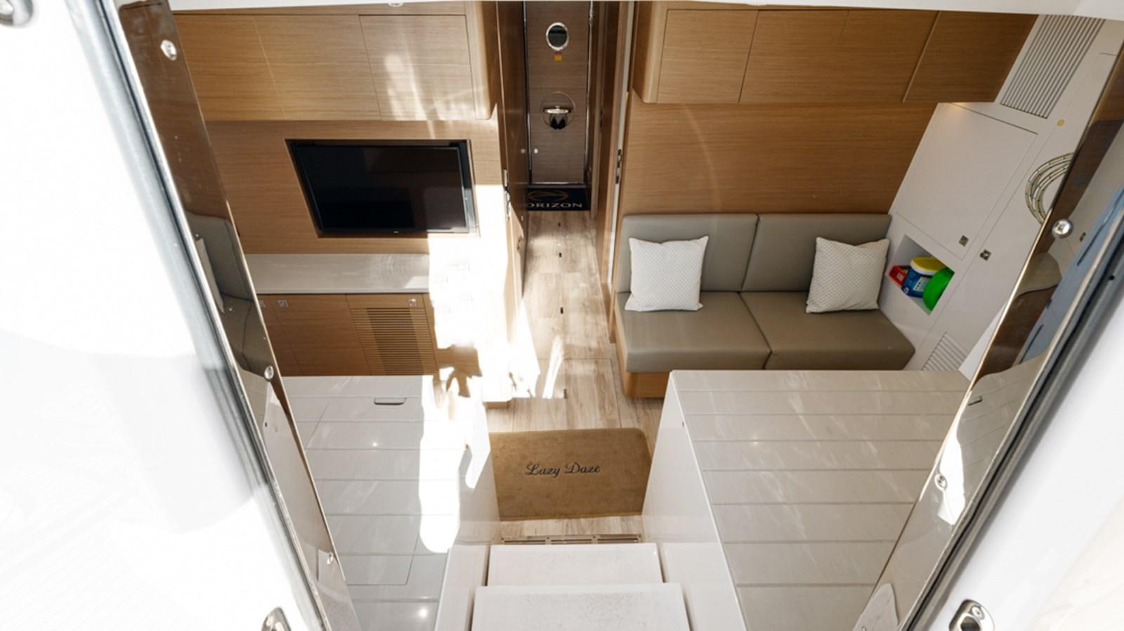a room with a bed and a television aboard 90 HORIZON Yacht for Sale