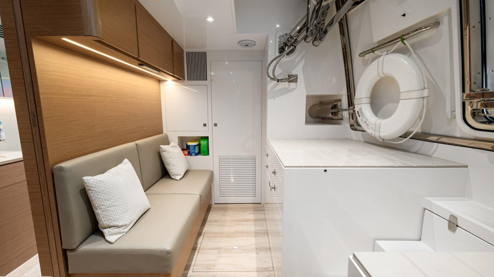 a room with a couch and a fan aboard 90 HORIZON Yacht for Sale