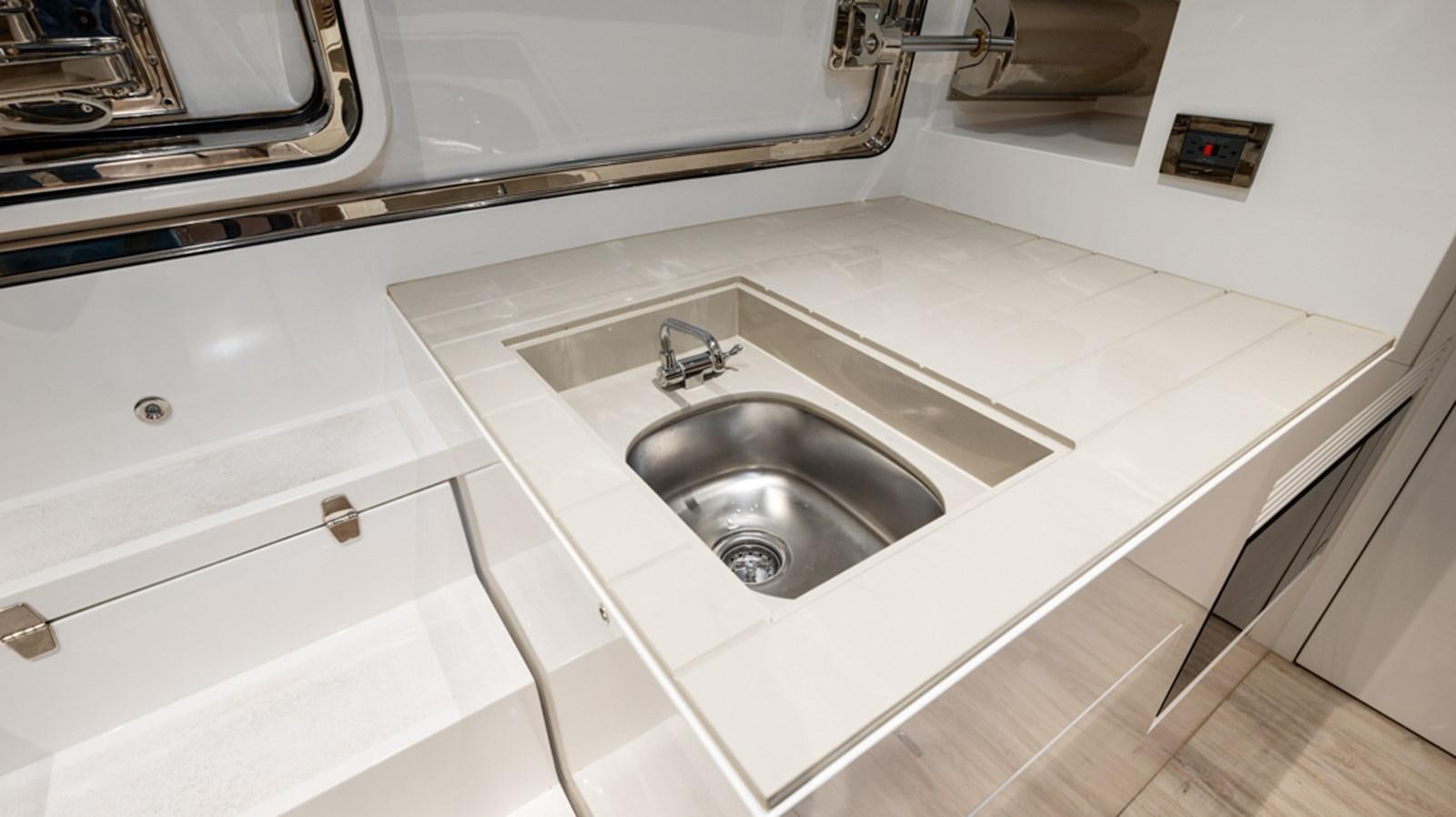 a sink in a kitchen aboard 90 HORIZON Yacht for Sale