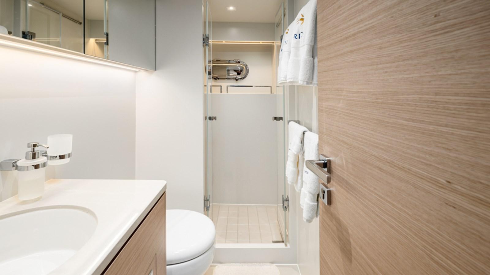 a bathroom with a shower and toilet aboard 90 HORIZON Yacht for Sale