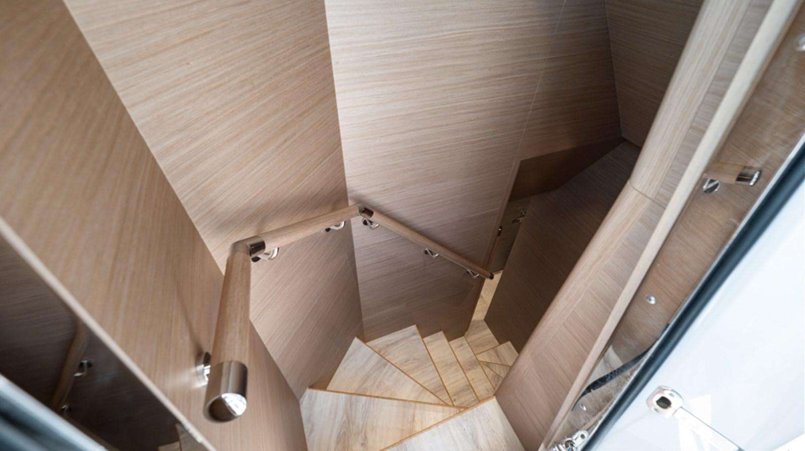 a wooden staircase with wooden walls aboard 90 HORIZON Yacht for Sale