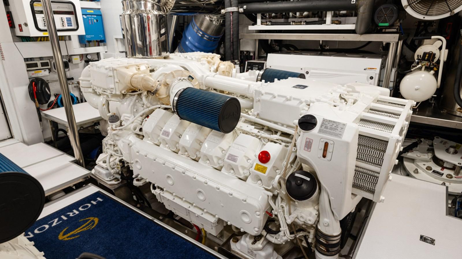 a white machine with blue and red lights aboard 90 HORIZON Yacht for Sale