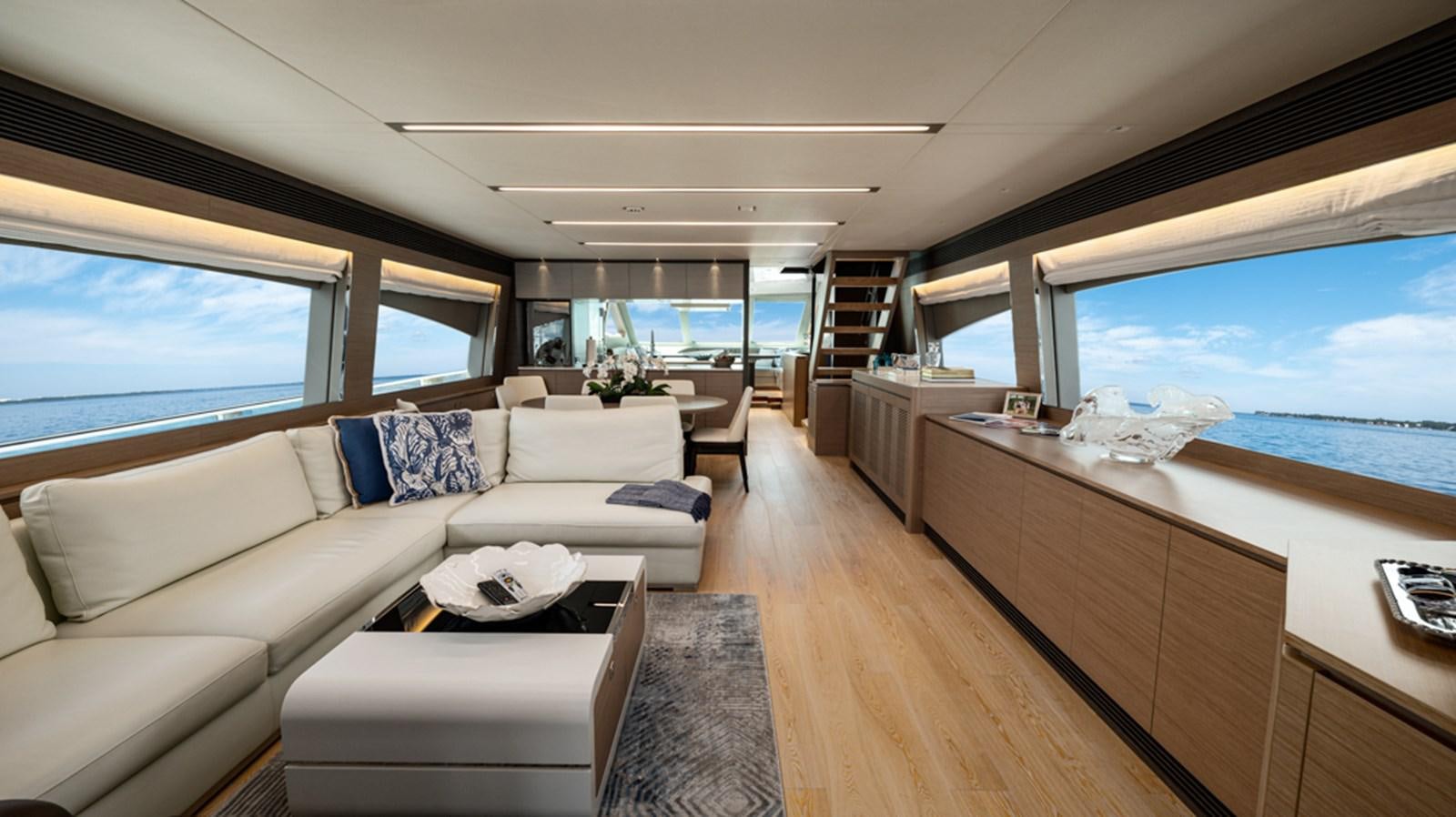 a living room with a large window aboard 90 HORIZON Yacht for Sale