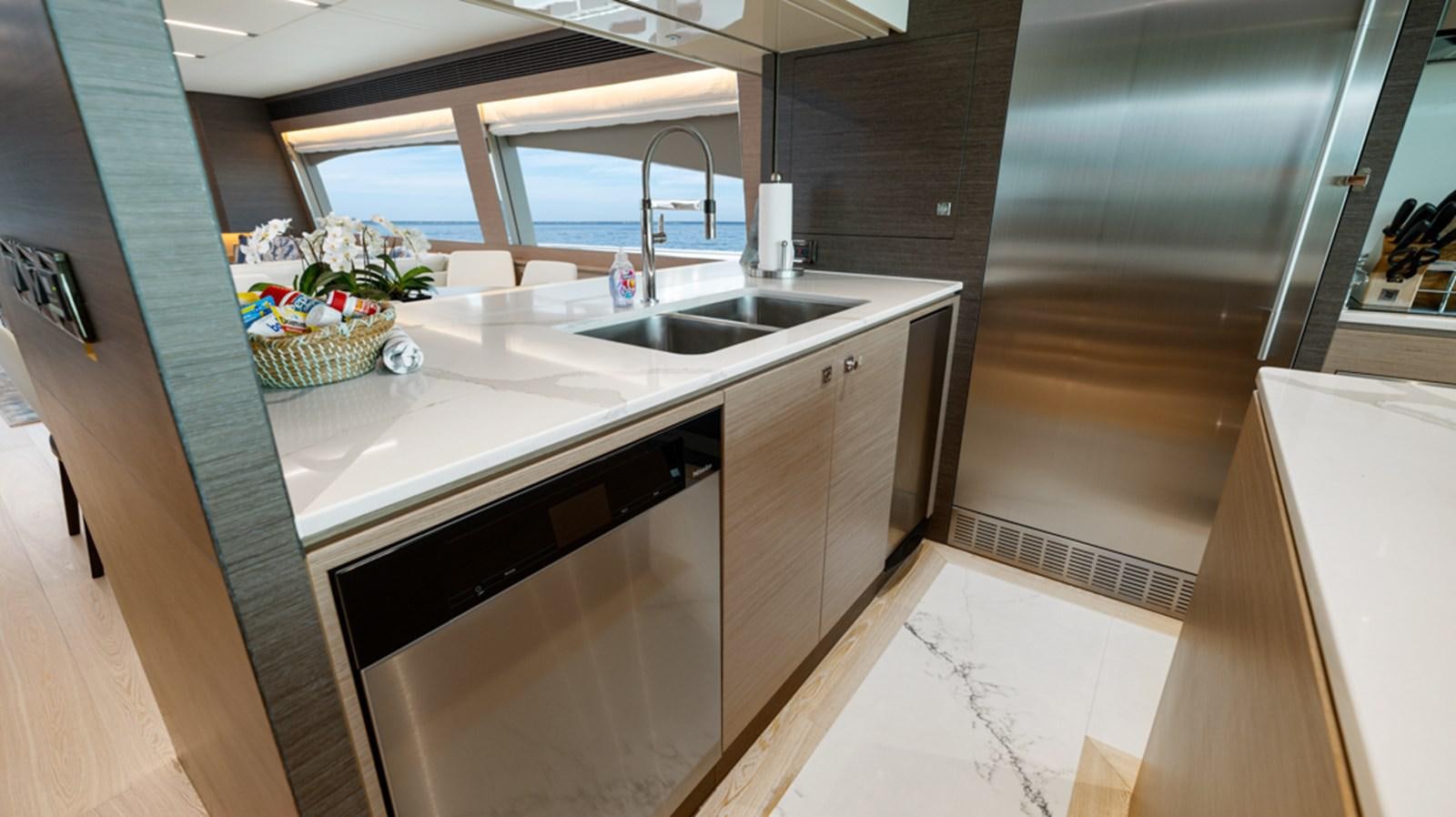 a kitchen with a sink and cabinets aboard 90 HORIZON Yacht for Sale