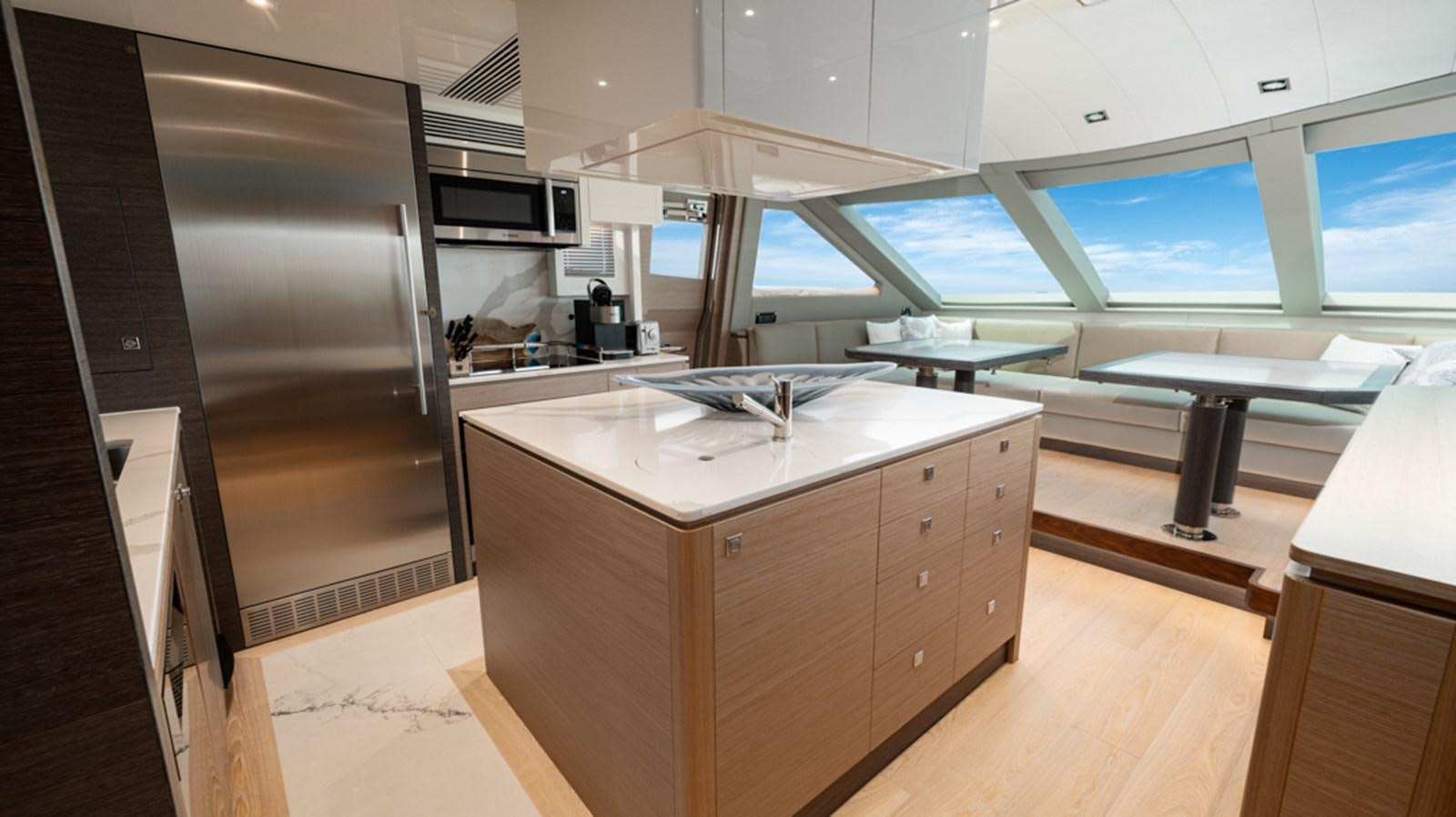 a kitchen with a large window aboard 90 HORIZON Yacht for Sale