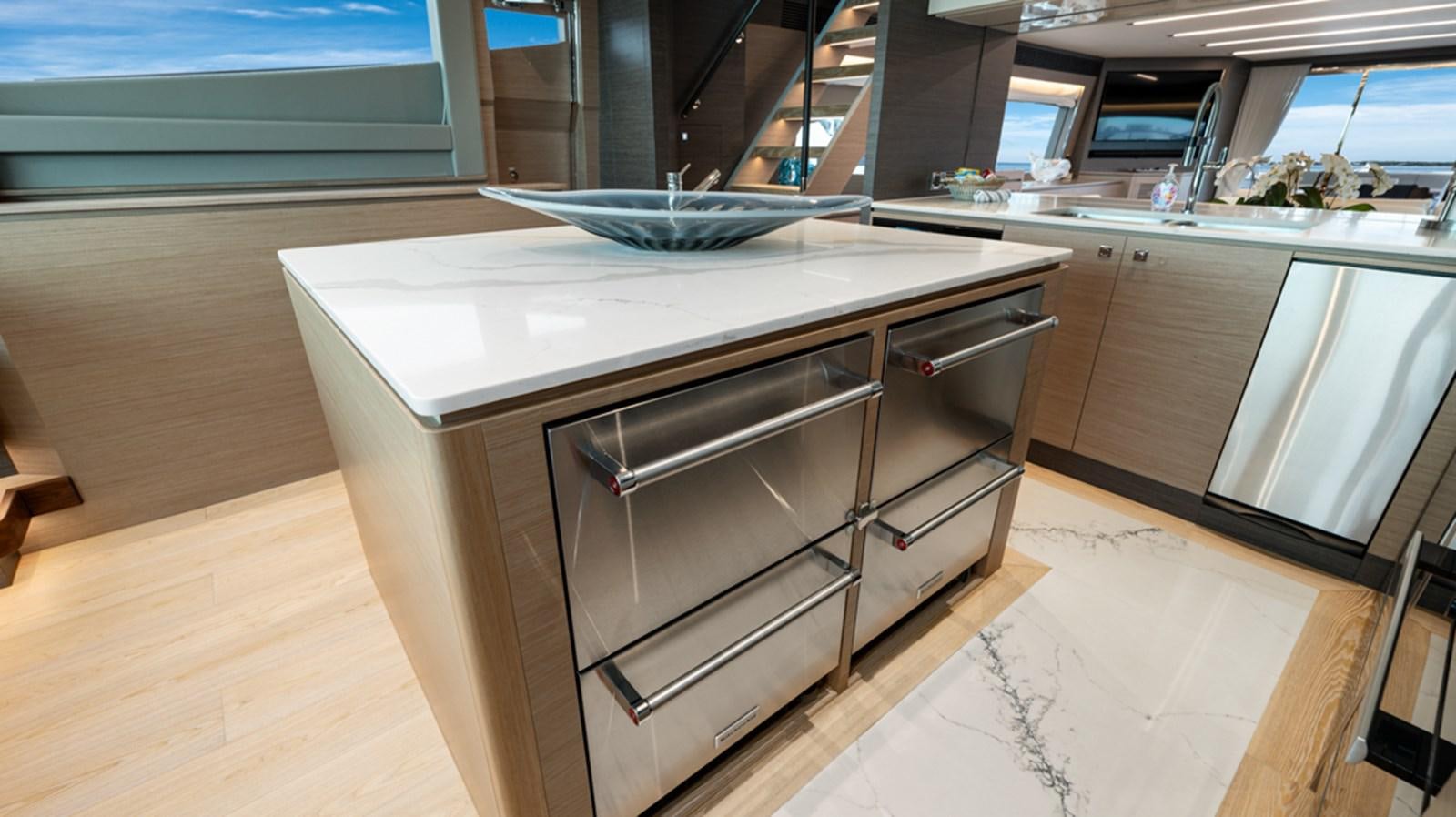 a kitchen with a large island aboard 90 HORIZON Yacht for Sale