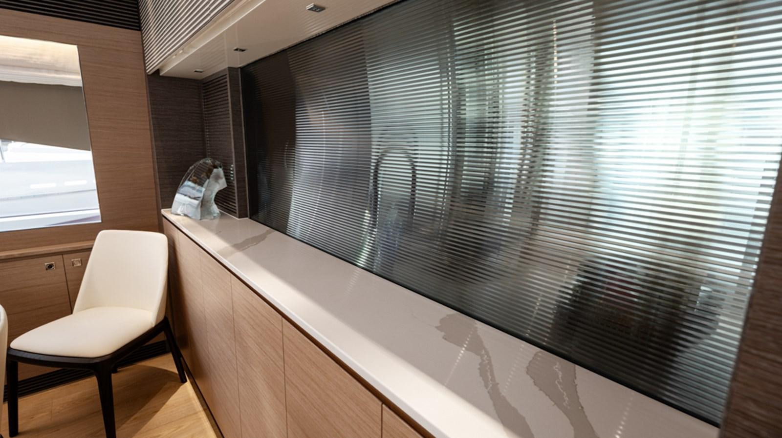 a chair in a room aboard 90 HORIZON Yacht for Sale