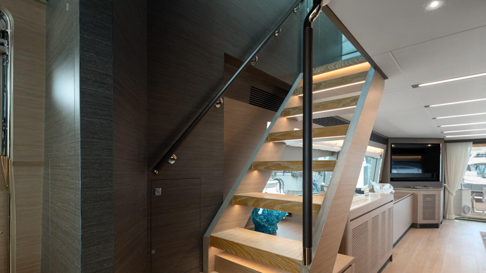 a wooden staircase in a house aboard 90 HORIZON Yacht for Sale