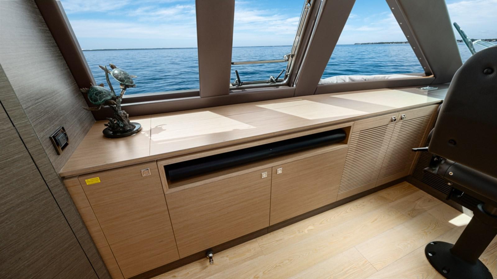 a room with a desk and a window aboard 90 HORIZON Yacht for Sale