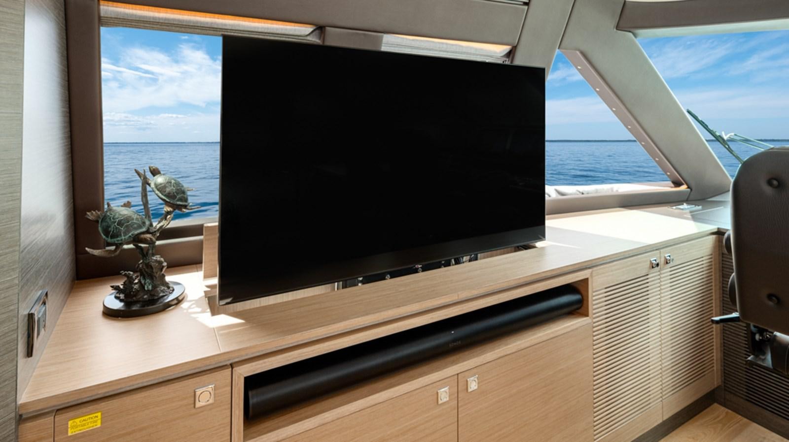 a tv on a stand aboard 90 HORIZON Yacht for Sale