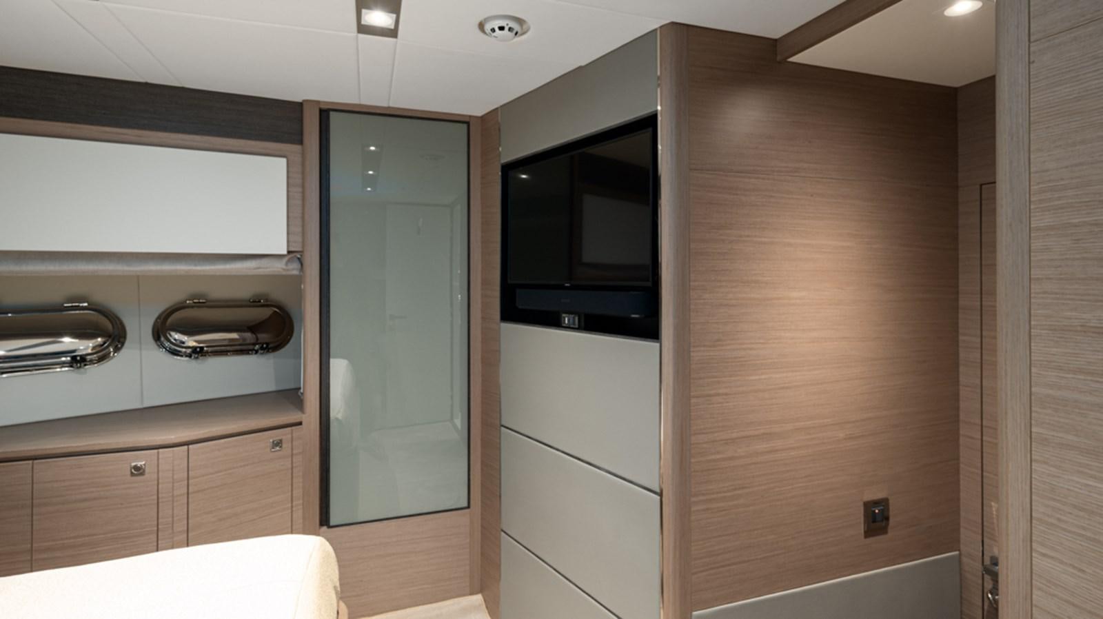 a room with a closet and a microwave aboard 90 HORIZON Yacht for Sale