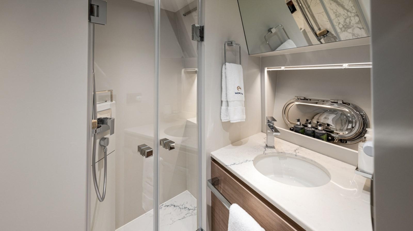 a bathroom with a sink and shower aboard 90 HORIZON Yacht for Sale
