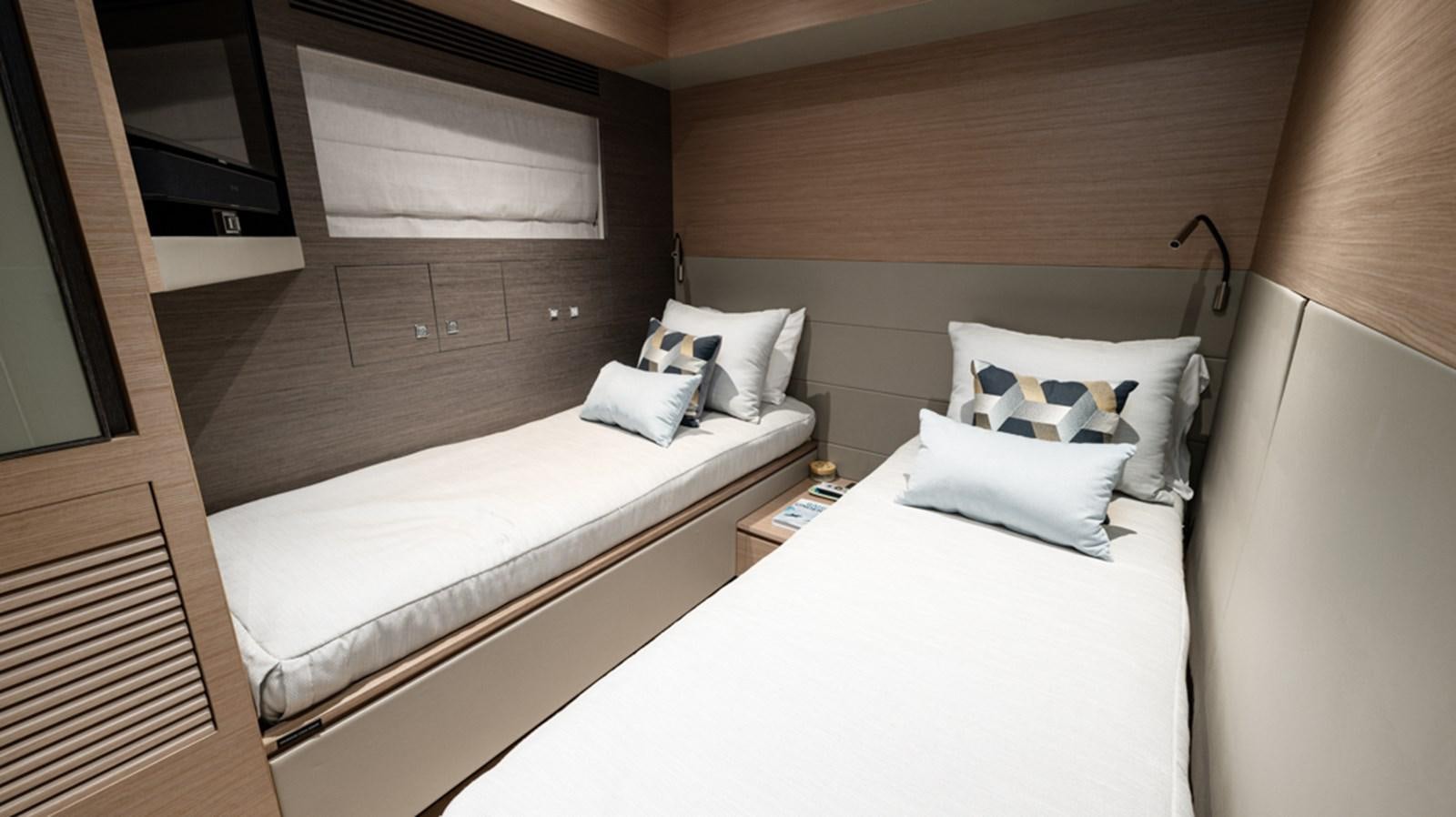 a room with two beds aboard 90 HORIZON Yacht for Sale