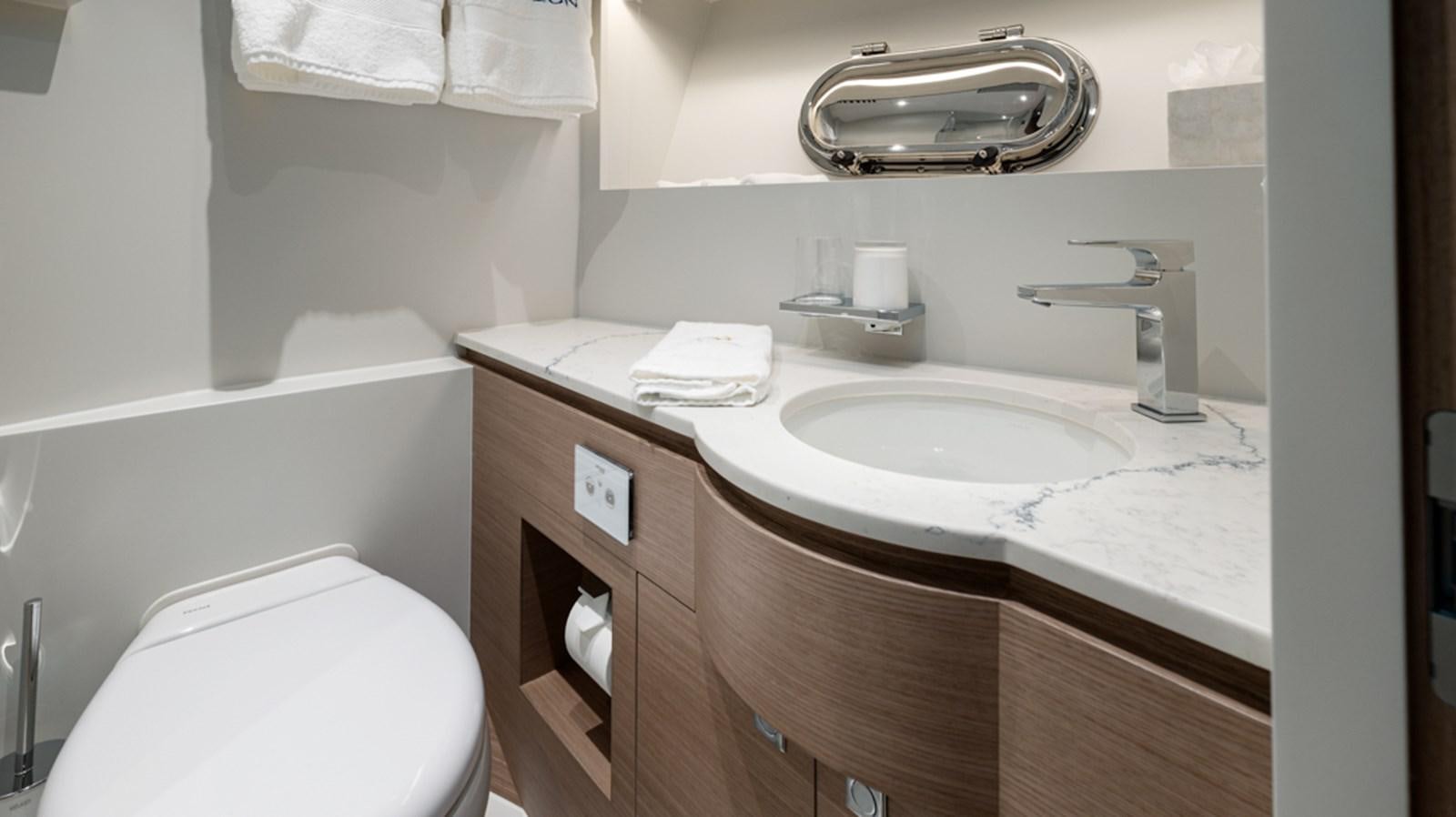 a bathroom with a sink and a toilet aboard 90 HORIZON Yacht for Sale