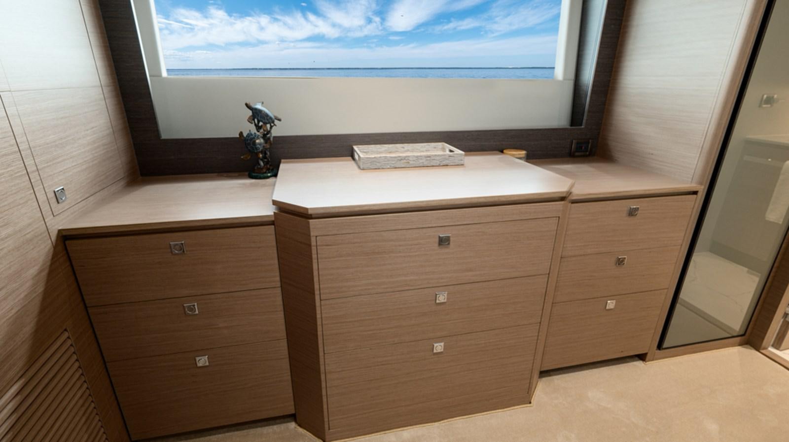 a tv on a dresser aboard 90 HORIZON Yacht for Sale