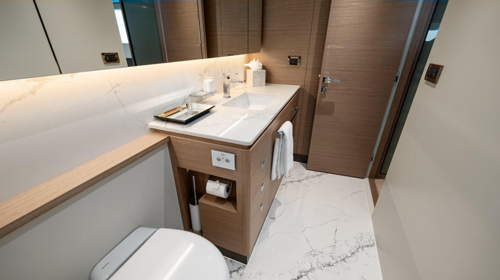 a bathroom with a sink and a toilet aboard 90 HORIZON Yacht for Sale