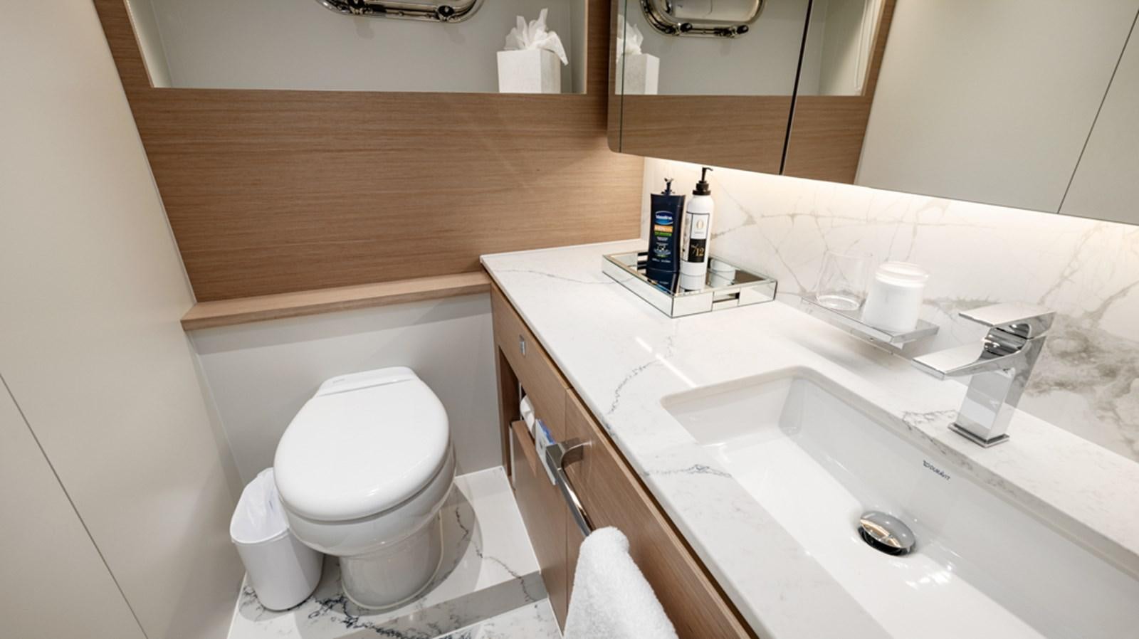 a bathroom with a sink and toilet aboard 90 HORIZON Yacht for Sale