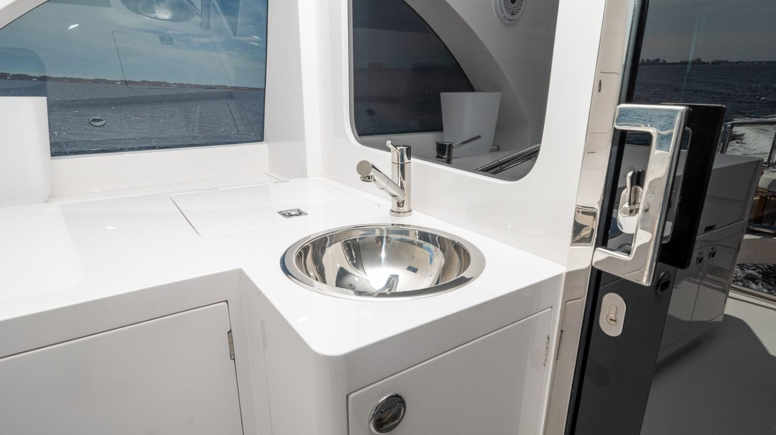 a sink in a bathroom aboard 90 HORIZON Yacht for Sale