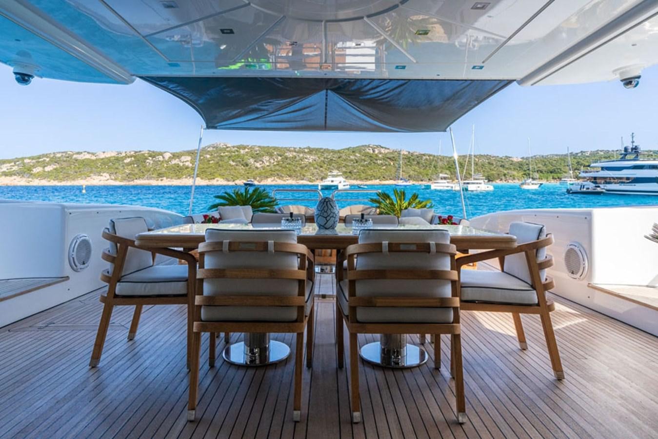 a table and chairs on a deck aboard PAULA & BIEL Yacht for Sale