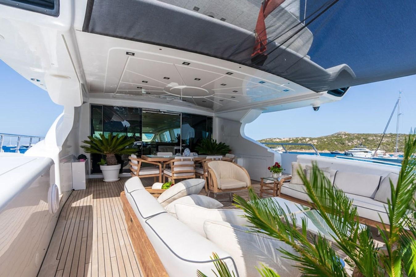 a deck with a pool and a deck with a deck and a large pool and a beach and aboard PAULA & BIEL Yacht for Sale