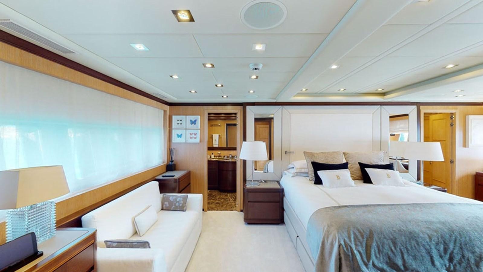 a room with a bed and a desk aboard PAULA & BIEL Yacht for Sale
