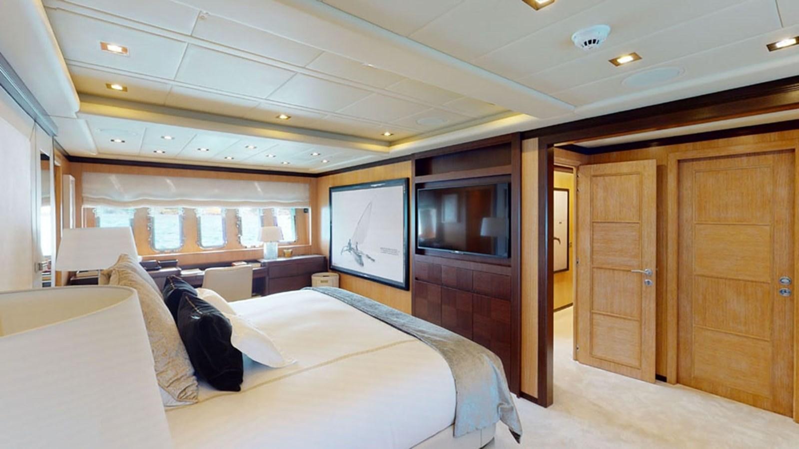a room with a bed and a television aboard PAULA & BIEL Yacht for Sale
