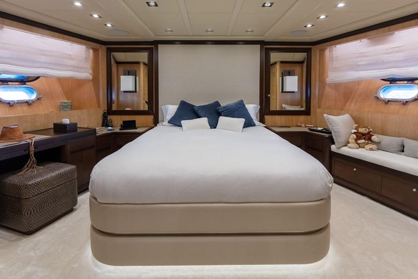 a bedroom with a bed and a desk aboard PAULA & BIEL Yacht for Sale