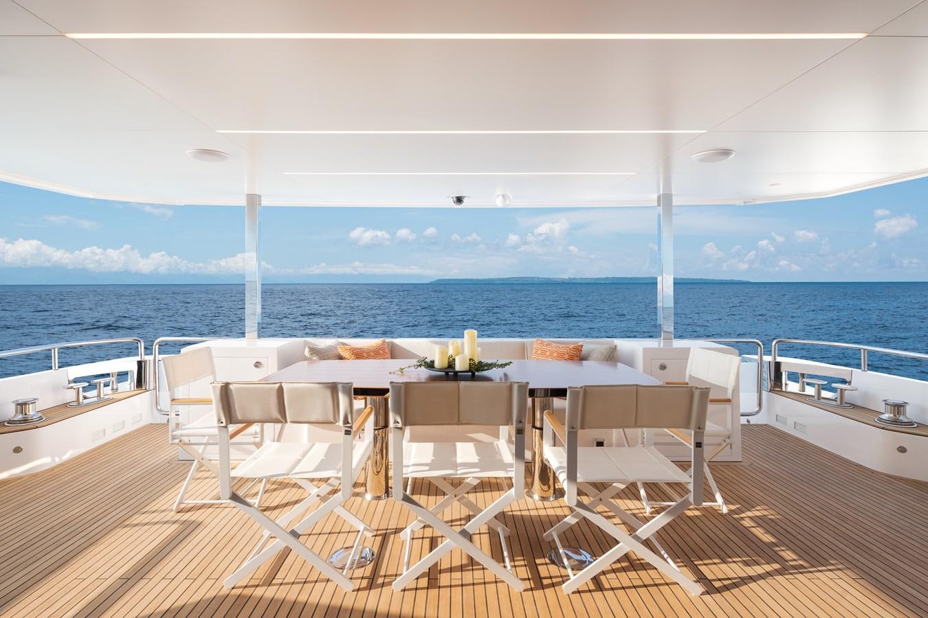a room with a table and chairs aboard HORIZON FD80-614 / NOW AVAILABLE  Yacht for Sale