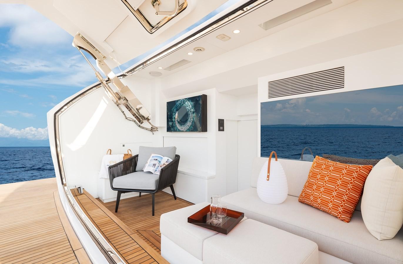 a room with a couch and a table and a window aboard HORIZON FD80-614 / NOW AVAILABLE  Yacht for Sale