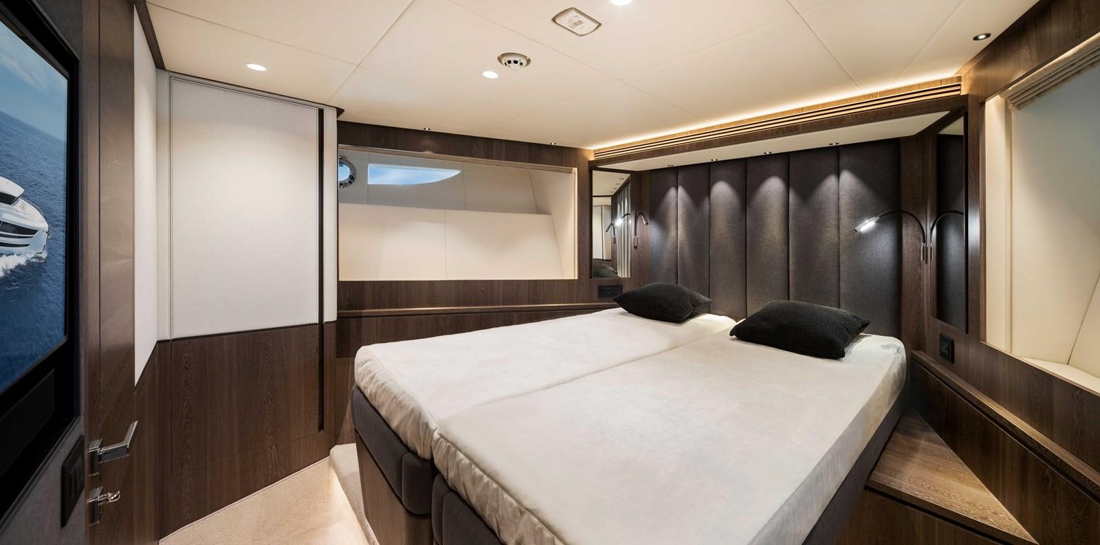 a room with a bed and a television aboard HORIZON FD80-614 / NOW AVAILABLE  Yacht for Sale
