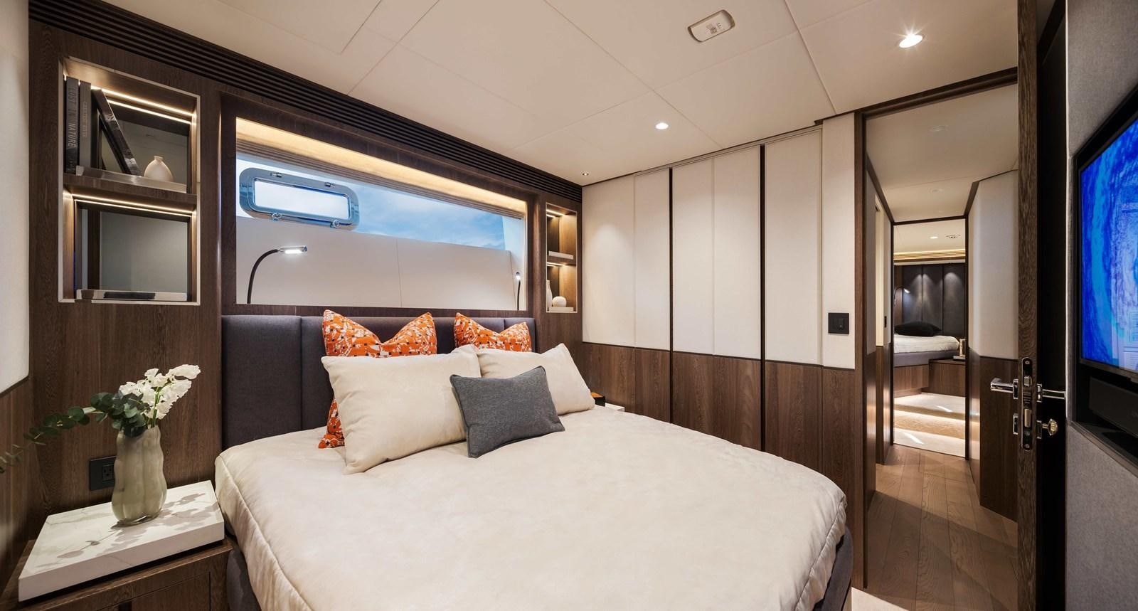 a bedroom with a bed and a mirror aboard HORIZON FD80-614 / NOW AVAILABLE  Yacht for Sale