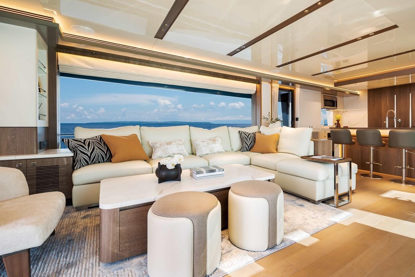 a living room with a large screen aboard HORIZON FD80-614 / NOW AVAILABLE  Yacht for Sale