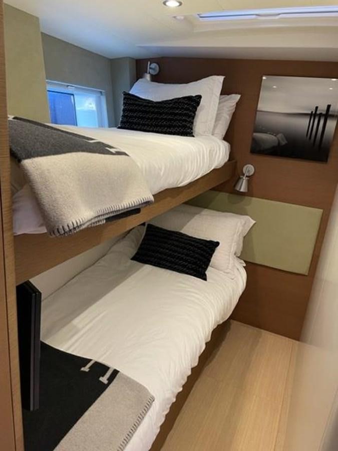 a couple of beds in a hotel room aboard TROIS VIGNES Yacht for Sale
