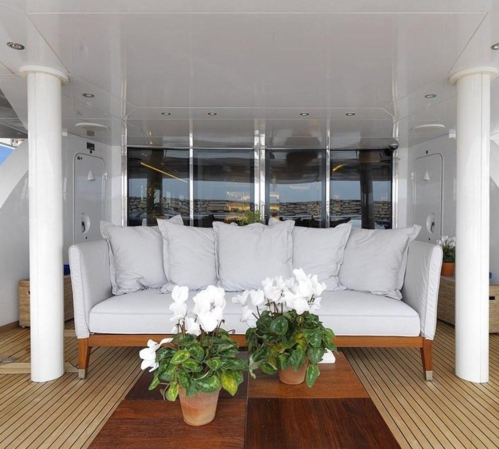 a living room with a white couch aboard LADY IN BLUE Yacht for Sale